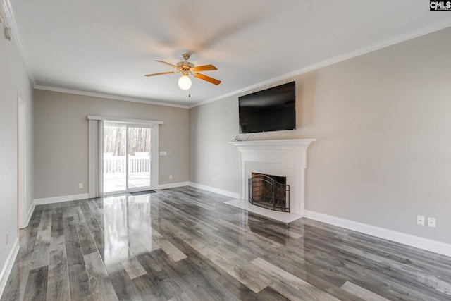 unfurnished living room featuring ceiling fan, ornamental molding, and dark hardwood / wood-style floors