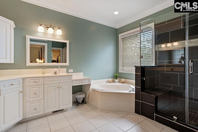 bathroom featuring independent shower and bath, crown molding, vanity, and tile patterned floors