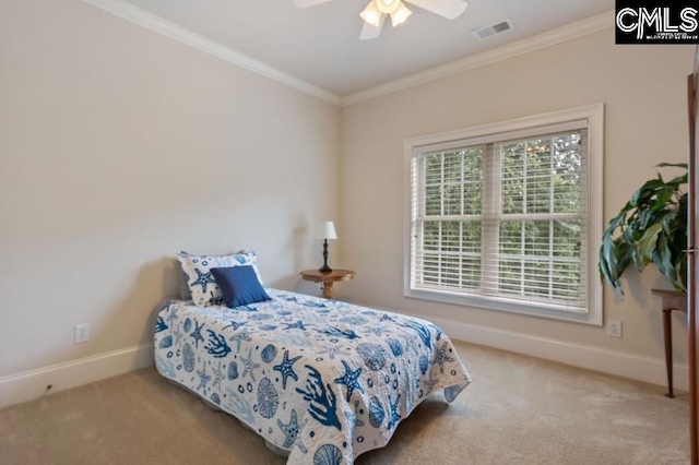 bedroom featuring crown molding, light colored carpet, and ceiling fan