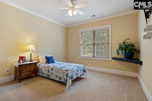 carpeted bedroom featuring crown molding and ceiling fan