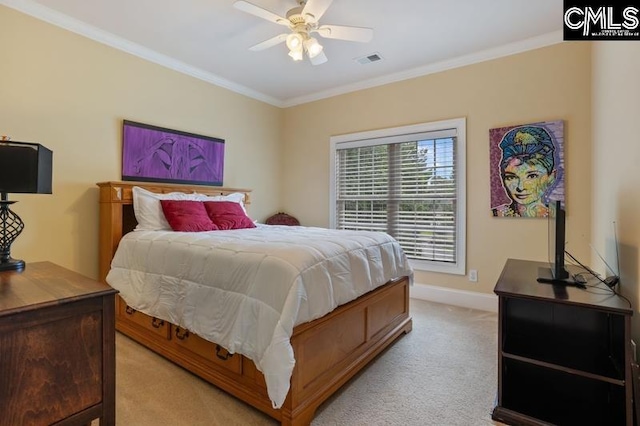 carpeted bedroom featuring ornamental molding and ceiling fan