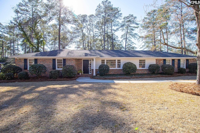 ranch-style house with a front lawn