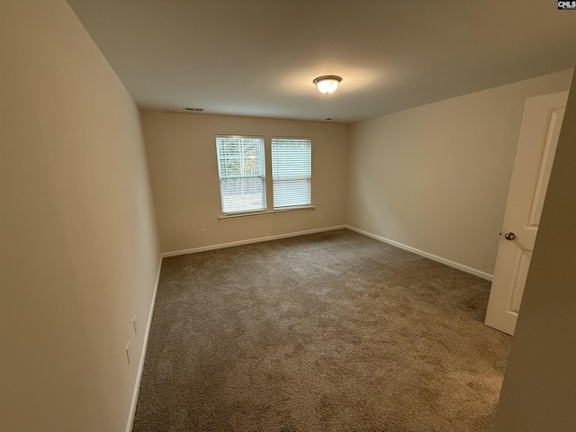 empty room featuring carpet flooring