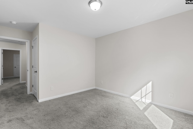 unfurnished room featuring carpet flooring