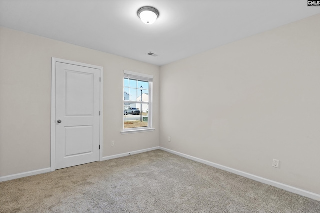 empty room with carpet flooring