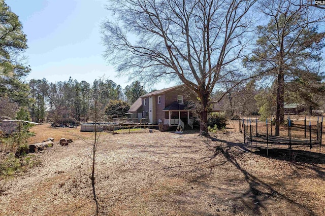 view of yard with a trampoline