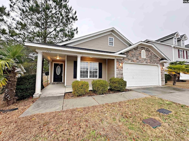 view of front of home with a garage and a porch