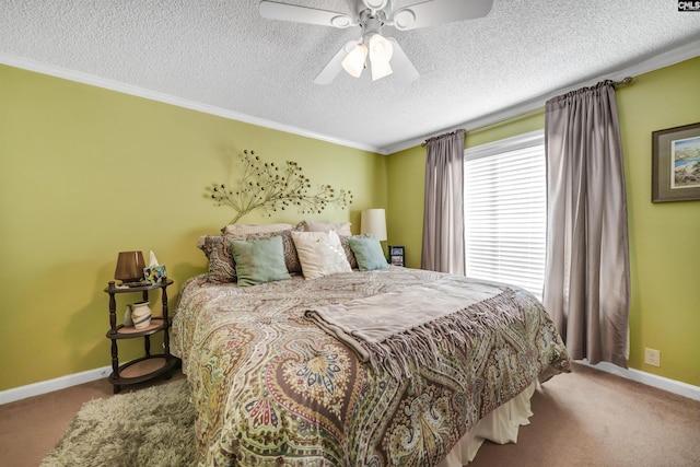 carpeted bedroom with ceiling fan, ornamental molding, and a textured ceiling