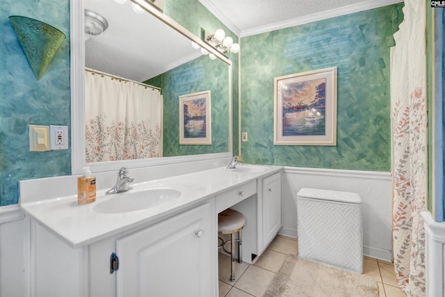 bathroom featuring vanity, crown molding, tile patterned floors, and a textured ceiling