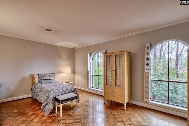 bedroom featuring crown molding and parquet flooring