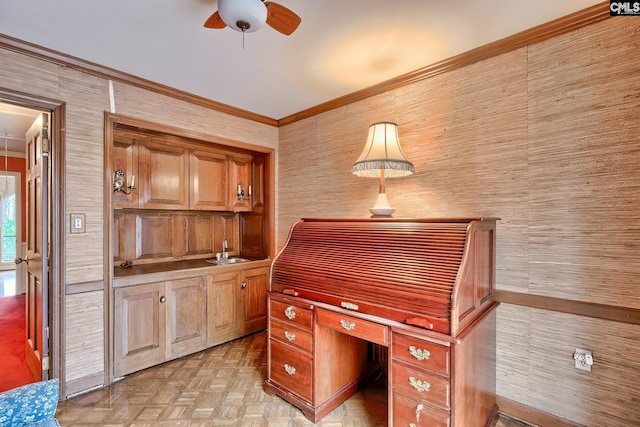 home office with crown molding, ceiling fan, sink, and light parquet floors