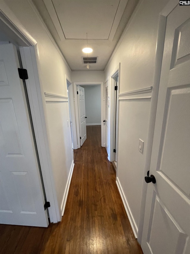 hall with dark hardwood / wood-style flooring