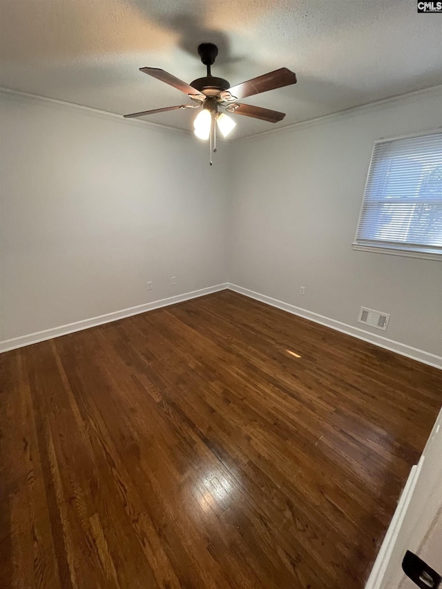 unfurnished room featuring ceiling fan, dark hardwood / wood-style floors, and a textured ceiling