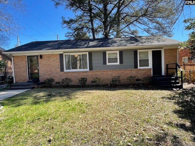 ranch-style home with a front lawn