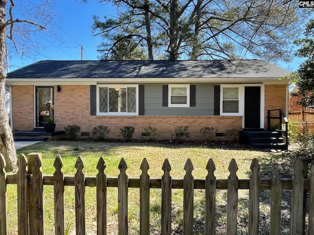 single story home featuring a front lawn