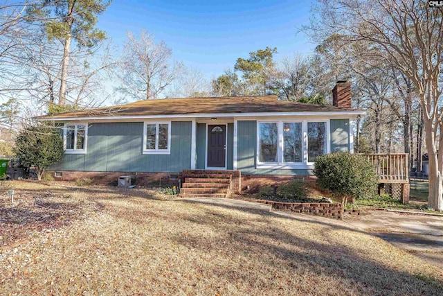 ranch-style house with a front lawn