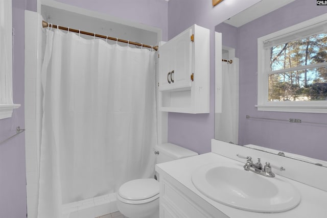 bathroom with vanity, a shower with curtain, and toilet