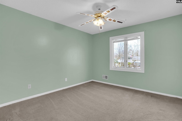 unfurnished room featuring carpet floors and ceiling fan