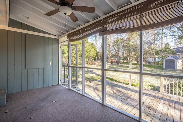 unfurnished sunroom featuring lofted ceiling and ceiling fan