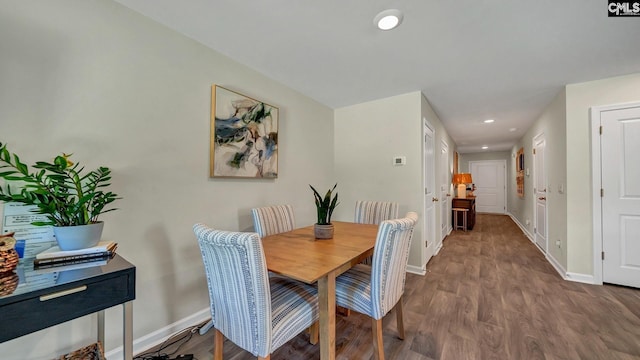 dining space featuring hardwood / wood-style floors