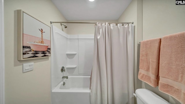 bathroom with shower / bathtub combination with curtain and toilet