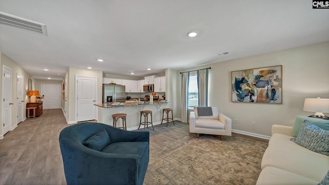 living room with light wood-type flooring