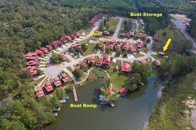 birds eye view of property with a water view