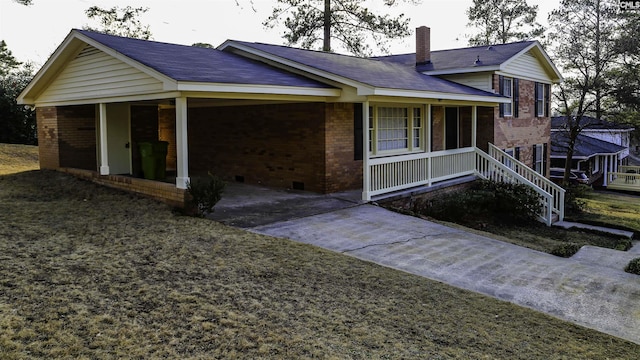 view of front of home with a porch and a front yard