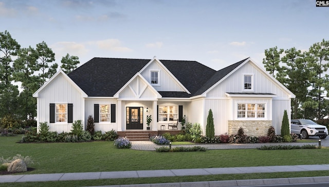 modern farmhouse with covered porch and a front lawn