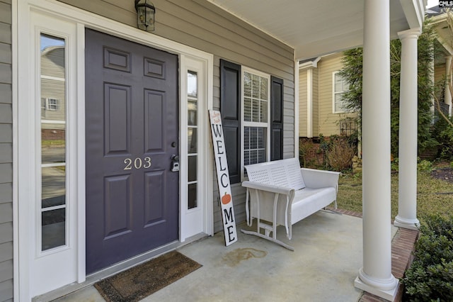 property entrance featuring a porch