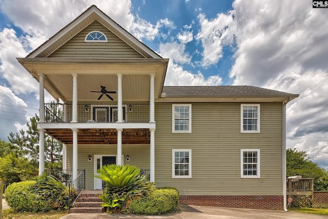 view of front of home featuring ceiling fan, a balcony, and a porch