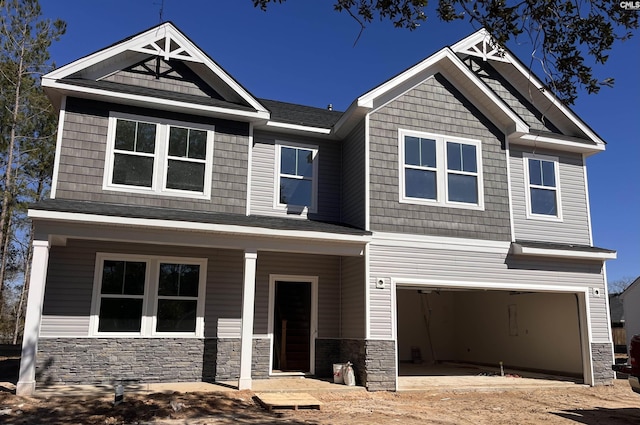 craftsman house featuring a garage and a porch