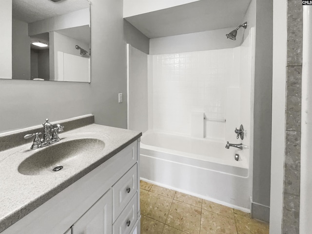 full bath with tile patterned flooring, vanity, and bathing tub / shower combination