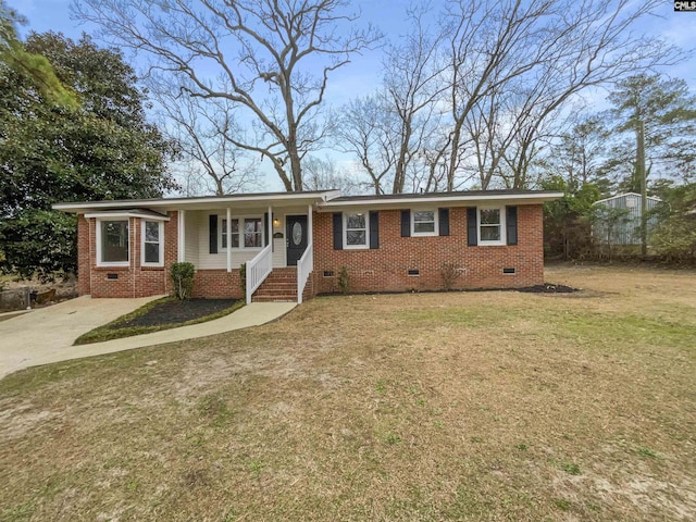 ranch-style home with a front lawn, crawl space, and brick siding