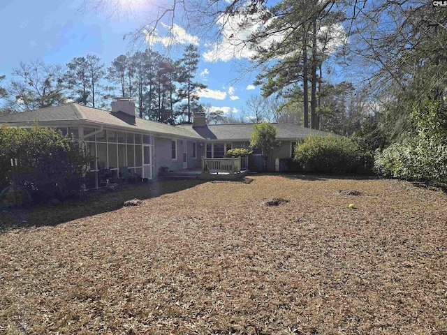 view of yard featuring a sunroom