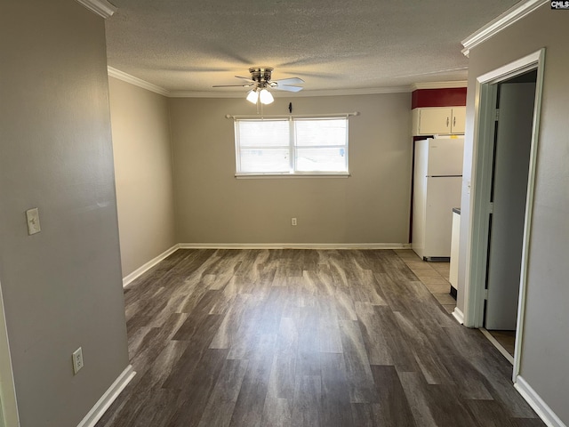 empty room featuring crown molding, a textured ceiling, and hardwood / wood-style flooring