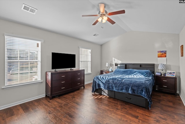 bedroom featuring vaulted ceiling, dark hardwood / wood-style floors, and ceiling fan