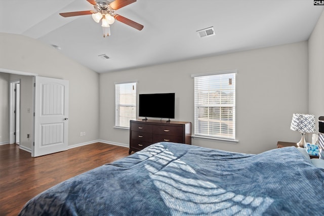 bedroom with vaulted ceiling, dark hardwood / wood-style floors, and ceiling fan