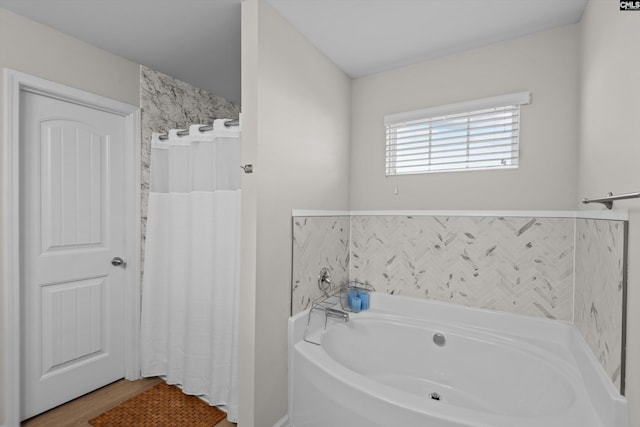 bathroom featuring a tub to relax in