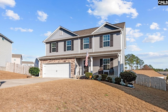 craftsman-style home featuring a garage and a front lawn