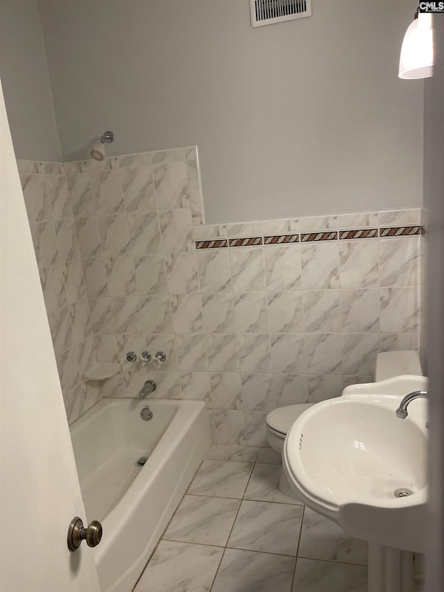 3442 Blossom St, Columbia, SC 29205 - bathroom featuring sink, a bath, tile walls, and toilet