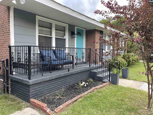 exterior space with a yard and covered porch