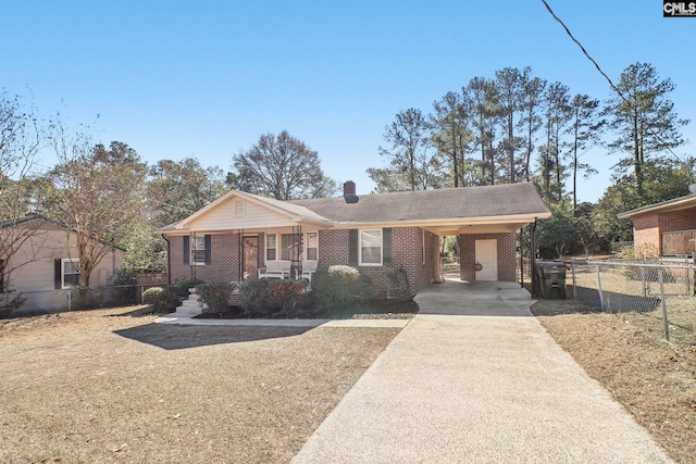 view of front of home with a porch and a carport