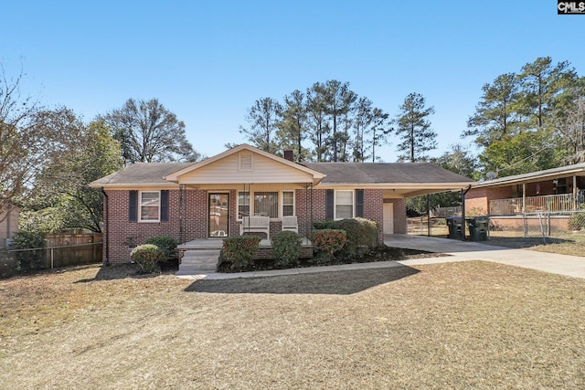 view of front facade featuring a carport and covered porch