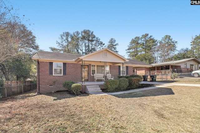 ranch-style home featuring a front yard and a porch