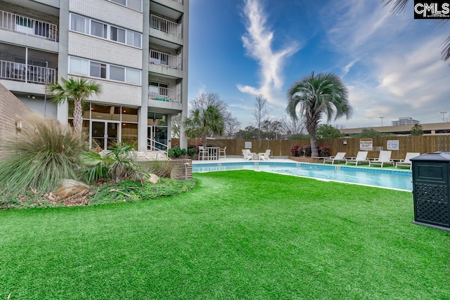 view of yard featuring a community pool