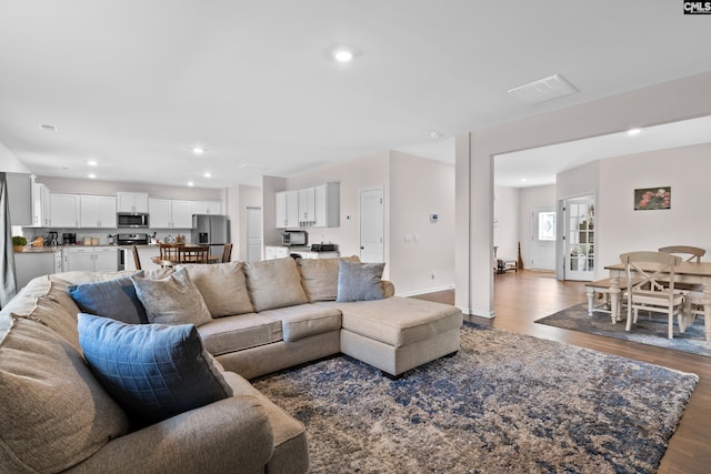 living room featuring dark hardwood / wood-style flooring