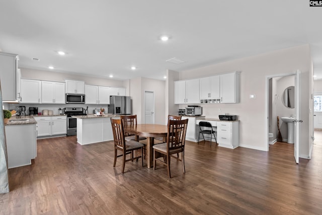 dining space featuring dark hardwood / wood-style floors