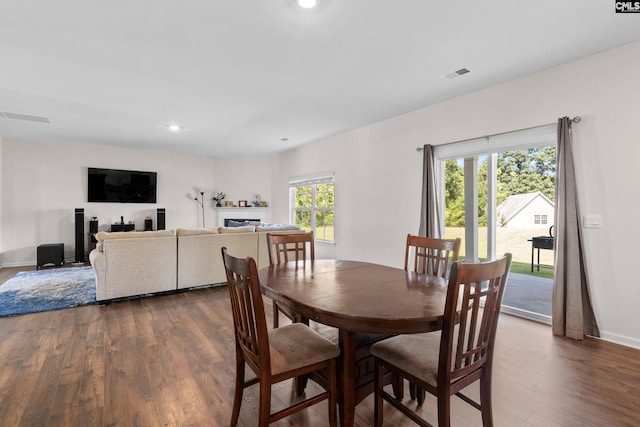 dining room with dark hardwood / wood-style floors