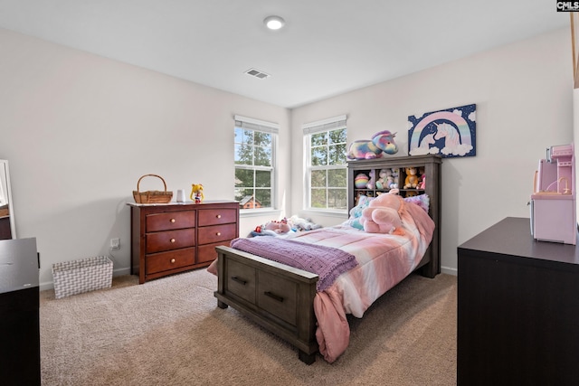 bedroom with light carpet